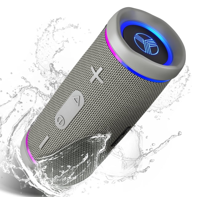 treblab hd77 - altavoz bluetooth portátil - potente sonido 360°: altavoz cilíndrico gris con rejilla textil, botones de volumen y reproducción, puerto USB-C y logo iluminado en el extremo; anillos LED azules y morados; salpicaduras que muestran resistencia IPX6; Bluetooth 30W con modo TWS para sonido estéreo de hasta 60W y batería de hasta 20h; incluye mosquetón para transporte, ideal para uso al aire libre.