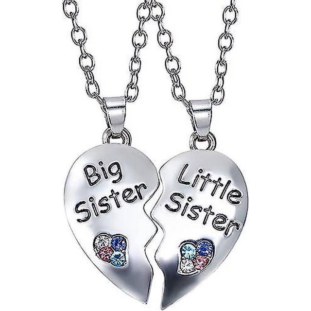 collar bff para 2, collares para mejores amigos, panda, delfín, pingüino, regalos para el día de san valentín, collares de amistad con diamantes de imitación y corazón dividido, colgante grabado — Primer plano frontal de dos mitades de corazón partido en acero inoxidable plateado; una mitad con relieve “Big Sister”, la otra con “Little Sister”, cada mitad tiene un pequeño corazón con diamantes de imitación en tonos azul y rosa y cuelga de cadenas de eslabones de 18 pulgadas; incluye caja de regalo. A menudo usado como collar de amistad para hermanas o mejores amigos.