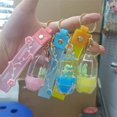thumbnail image 1 of Llavero personalizado personalizado de Hello Kitty, botella de leche acrílica, líquido que fluye, llavero de arena movediza, colgante de líquido móvil, 1 of 3