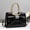 f199Black, variant on Women's Glossy Khaki Patent Leather Tote Bag with Bow & Rhinestone Detail, Gold-Tone Braided Handles, Convertible Crossbody Strap