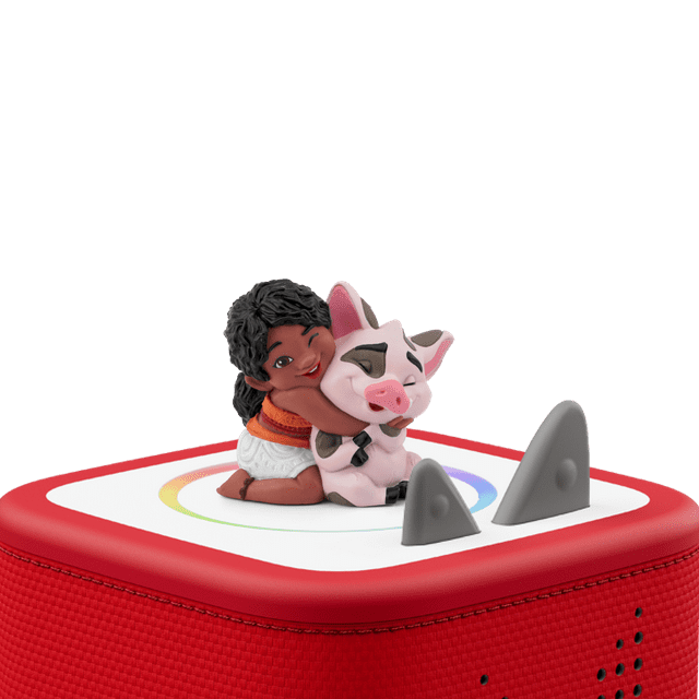 Tonies audio character featuring Moana hugging Pua the pig, placed on a red Toniebox speaker base with control ears.