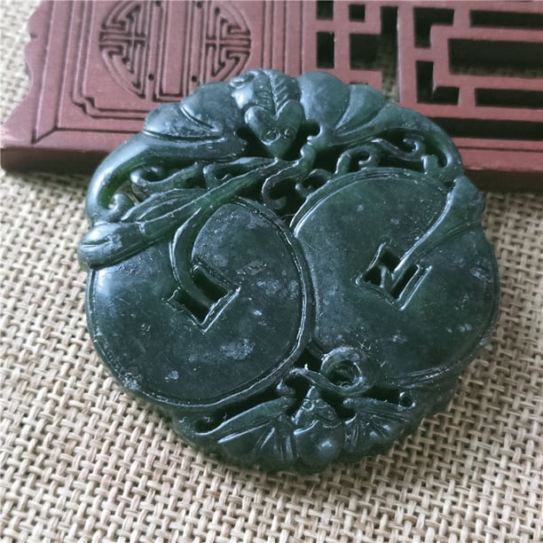 Jade pendant, made of black ink jade with openwork snake pattern, translucent green under light, magnetic jade.