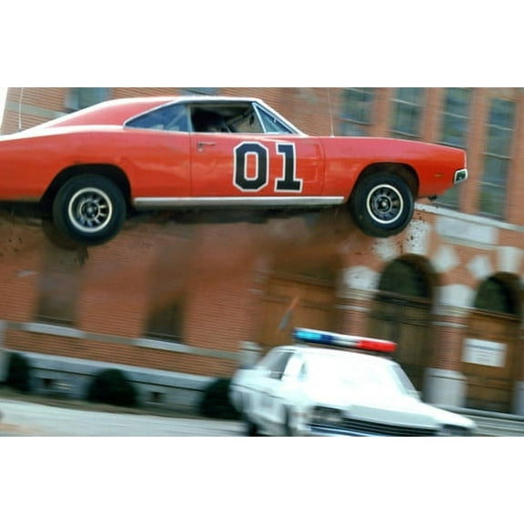 Dukes Of Hazzard General Lee flies in air over Plymouth Fury police car 24X36 Poster