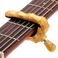 thumbnail image 2 of Cejilla Yashi con diseño de calavera y dedos para guitarra acústica, eléctrica y ukelele color negro, 2 of 5