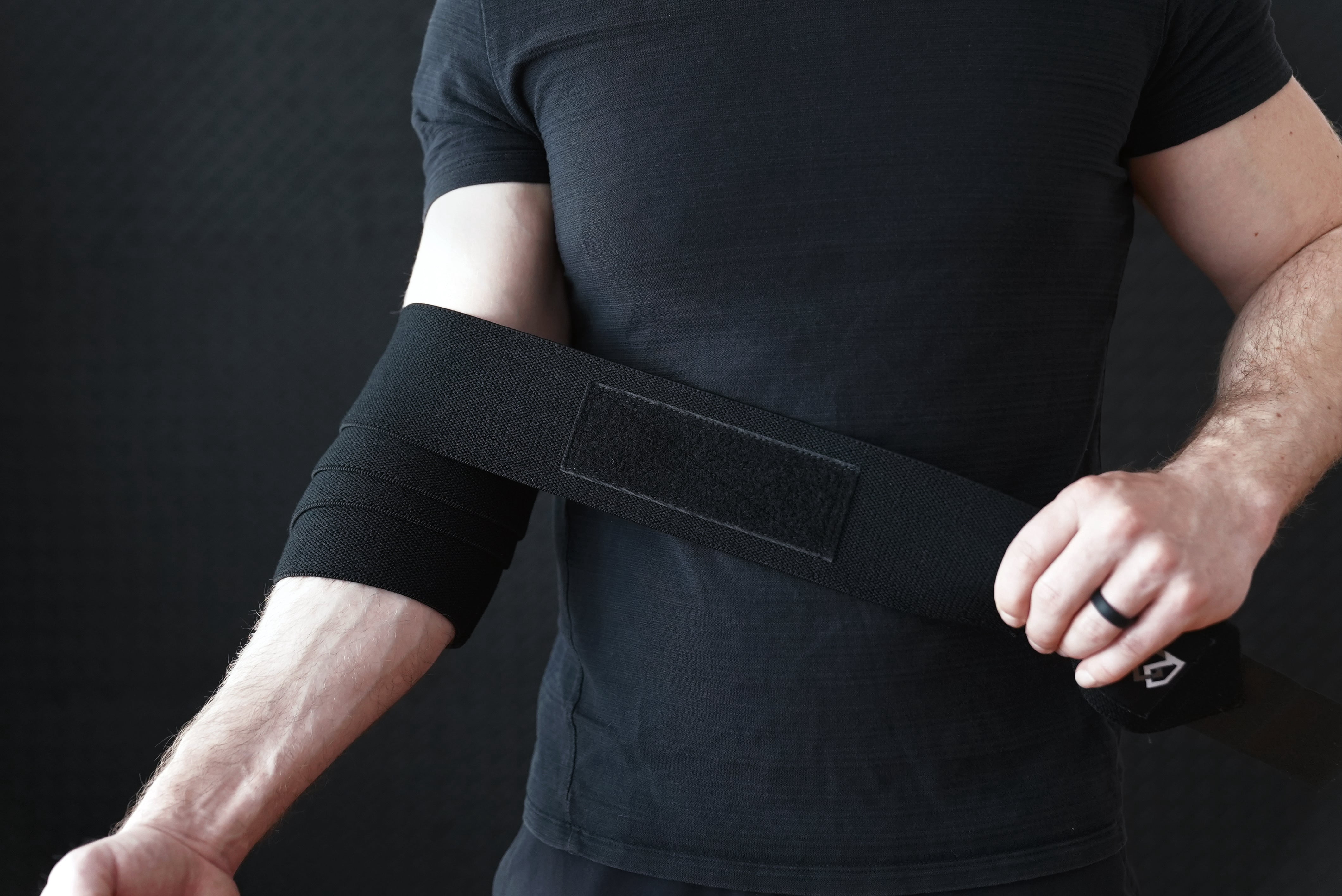 Bay Gear Co. Weightlifting Elbow Wraps (1 Pair) - Flexible Elbow Compression Strap & Joint Support Brace - For Bench Press, Powerlifting, Overhead Pressing and Heavy Lifts - Black