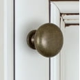 thumbnail image 4 of GlideRite 1.125 in. Solid Classic Round Cabinet Knobs, Antique Brass, Pack of 5, 4 of 5