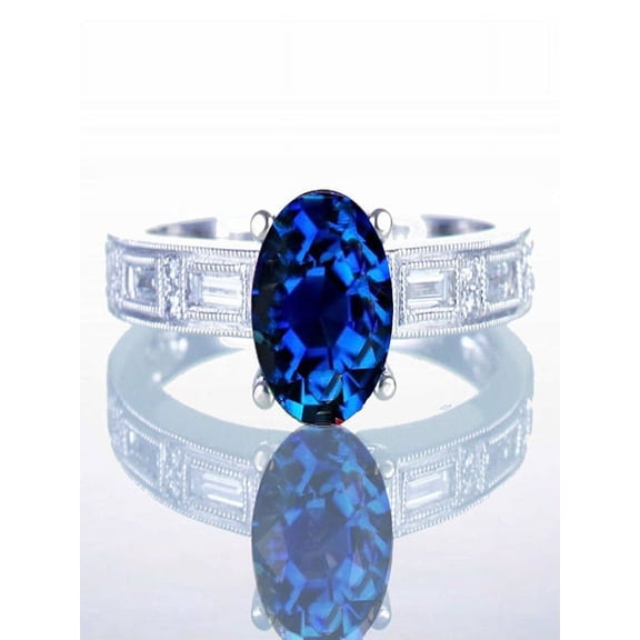 1.5 Carat Oval Cut Sapphire and Baguette Diamond Milgrain Engagement Ring on 10k White Gold