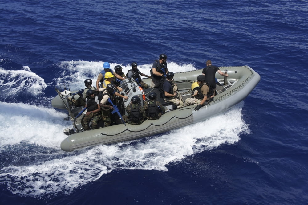 A rigid-hull inflatable boat carrying Marines from the Uganda People?Ø¬æ¬¥?Ø¬æ¬†?Ø¬æ¬¥s Defense Force Canvas Art - Stocktr