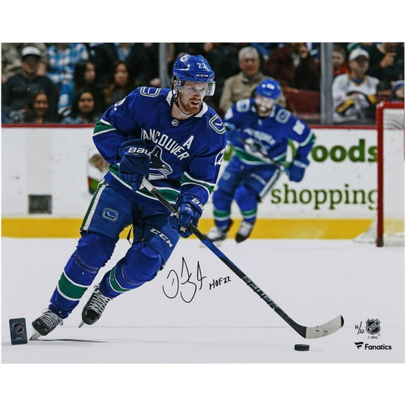 Daniel Sedin Vancouver Canucks Autographed 16" x 20" Blue Jersey Skating Photograph with "HOF 22" Inscription - Limited