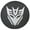Silver Metallic Decepticon Print, variant on Brawny Decepticon - 35-in w/Camera - US Made SpareCover® - Brawny Series Transformers - Heavy Jet-Black Vinyl Denim Texture - High Endurance Tire Cover