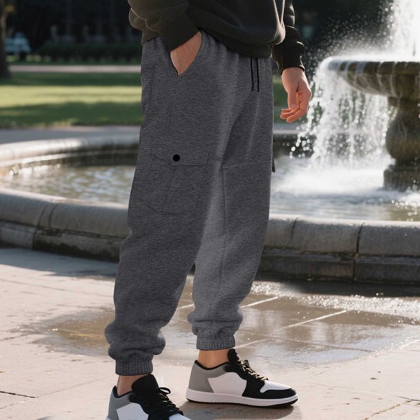 Pantalones largos para hombre, estilo casual, a la moda, con cordón en la cintura y múltiples bolsillos, elásticos, para sujetar los pies, de rayón.