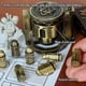 thumbnail image 4 of Set de dados CZYY Metal Polyhedral Bullet Style Cyberpunk Bronce, 4 of 9