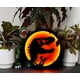thumbnail image 4 of Letrero LED de pared con el logotipo de T-Rex de Parque Jurásico de Ukonic, 30 cm, 4 of 8
