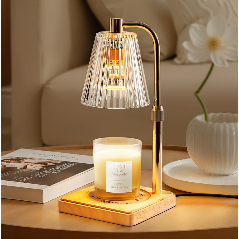 Adjustable brass candle warmer lamp with a ribbed glass shade and wooden base