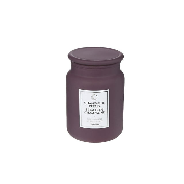 19 Oz Luxe Scented Candle With Glass Lid (Champagne Petals) in a matte purple glass jar with matching lid and white label, designed for home décor and aromatherapy to create a relaxing ambiance.
