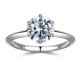 thumbnail image 1 of Anillo solitario redondo de moissanita SMILEST de 2 quilates en D, color VVS1, 1 of 8