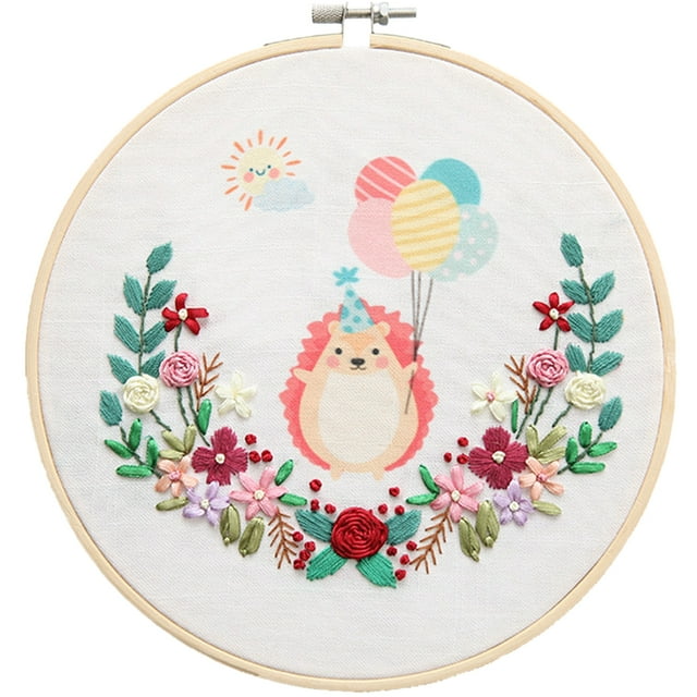 Embroidery Starter Kit Full Range DIY Cartoon Animal Cross Stitch Kit Craft Kit featuring a multicolor design of a hedgehog wearing a party hat, holding balloons, surrounded by embroidered flowers and leaves. The kit includes a 20cm (7.87in) bamboo embroidery hoop, cotton linen fabric, and all necessary materials for beginners and craft enthusiasts. Ideal for home or office decoration or as a thoughtful gift.