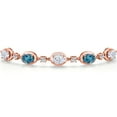 thumbnail image 3 of Gem Stone King 18K Rose Gold Plated Silver Moissanite and London Blue Topaz Bracelet for Women | 4.70 Cttw | Gemstone Birthstone | Oval 7X5MM | Fully Adjustable 9 inch, 3 of 6