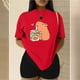thumbnail image 3 of Playera Blusa Divertida De Capybara Tomando Jugo Ropa De Mujer Capibara Color Rojo Talla Grande Marca Emil SaEs, 3 of 4