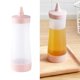thumbnail image 4 of botellas de condimentos con boquilla exprimible, recipientes para salsa de ketchup y mostaza para condimentos de cocina, beige y rosa, 4 of 8