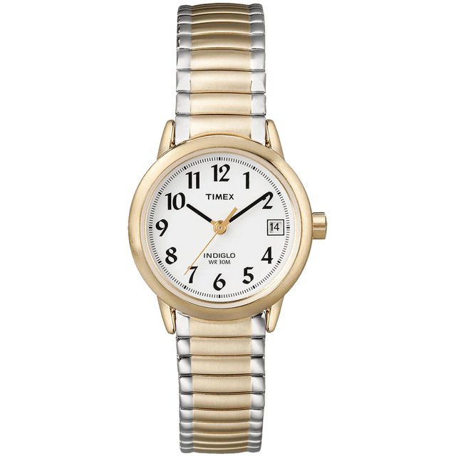 reloj analogico timex easy reader 25mm indiglo banda extendible acero inoxidable mujer dorado Vista frontal centrada del reloj Timex Easy Reader 25 mm con caja dorada, correa extendible bicolor de acero inoxidable, esfera blanca con números arábigos grandes negros, tres agujas doradas y ventana de fecha a las 3; marca INDIGLO y WR 30M en la esfera. A menudo usado como reloj de viaje por su tamaño compacto.