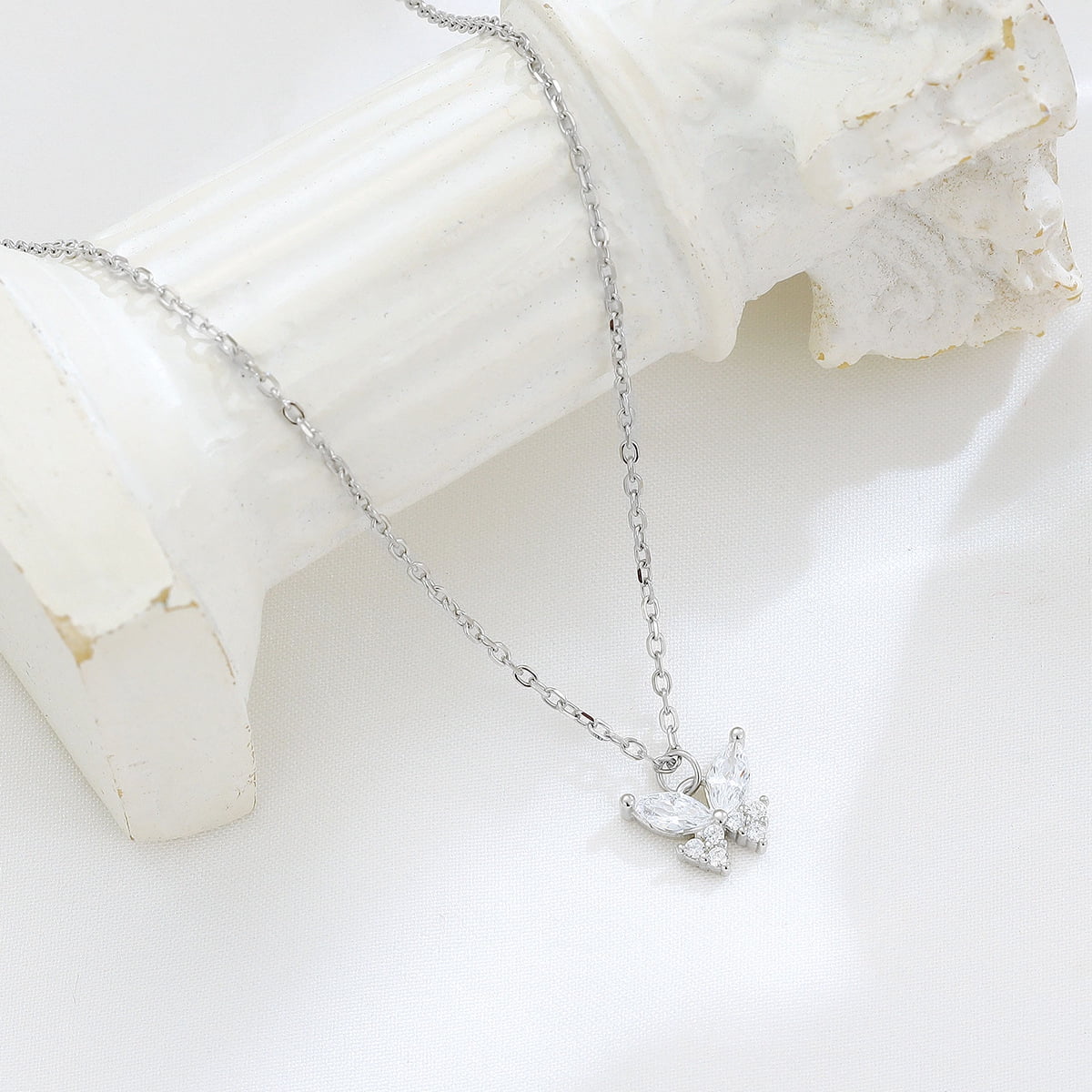 A 925 sterling silver butterfly necklace, set with dazzling diamonds, features a unique and elegant design. This simple butterfly clavicle necklace is an ideal high-end gift for women and a perfect g