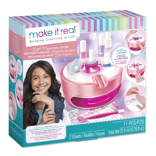 Make It Real Light Magic Nail Studio featuring a pink and white nail dryer, nail lamp, and application station designed for kids to create spa-like manicures. Includes five nail polish colors, a drying tray, and molded compartments to prevent spills and mess. The packaging highlights the product features and accessories.