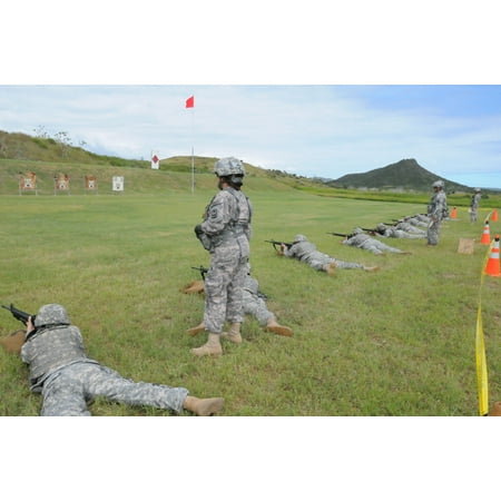 LAMINATED POSTER Members of the 525 Military Police Battalion fire during a weapons qualification course at the Windw Poster Print 24 x
