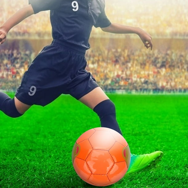 Kid kicking soccer ball cheap
