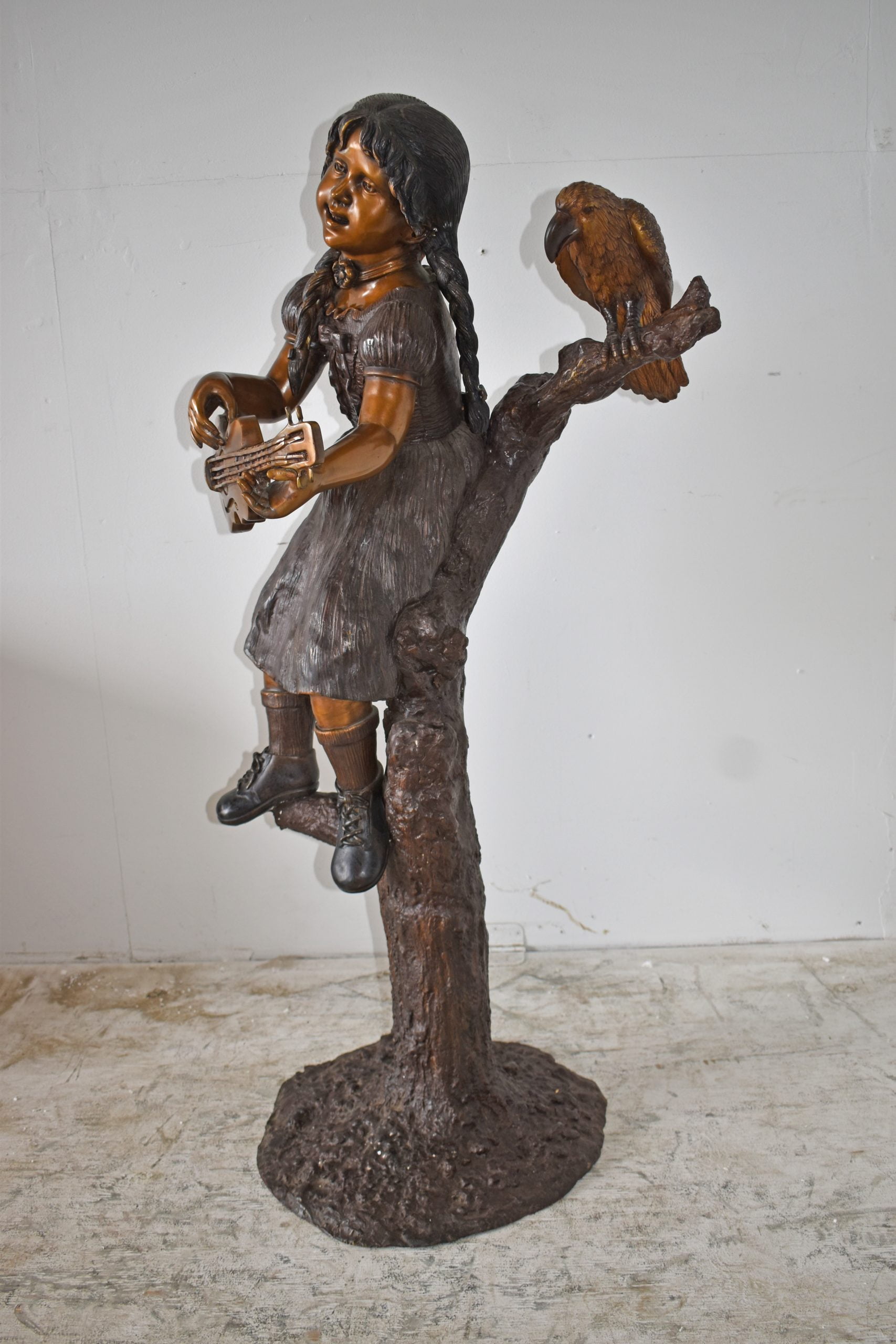 Nifao Girl on a Tree Playing the Ukulele with a Parrot Bronze Statue – Garden Outdoor Decor Sculpture, 25"L x 23"W x 50"H