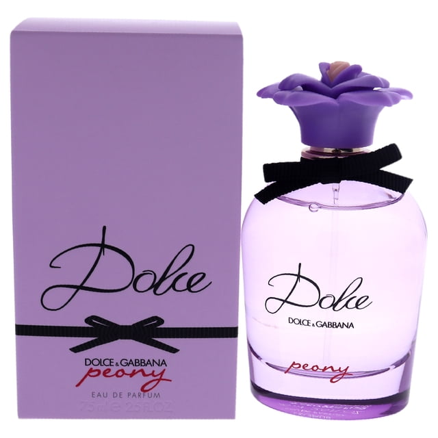 perfume edp Dolce and Gabbana - botella de vidrio rosada lavanda con tapa en forma de flor morada y lazo negro, junto a su caja lavanda con logo "Dolce"; fragancia gourmand floral y afrutada lanzada en 2019, también apta para exhibir en tocador.