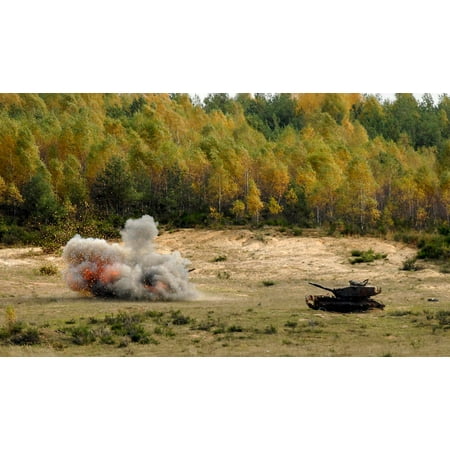 An M60 Patton tank explodes after being hit with an FGM-148 Javelin anti-tank guided missile Poster Print by Stocktrek