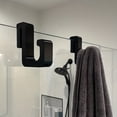 thumbnail image 1 of 3 ganchos de baño resistentes for puerta de vidrio de 8 mm | No requiere perforación | Material plástico resistente | Montaje en pared | Ideal for colgar ropa y toallas | Negro, 1 of 3