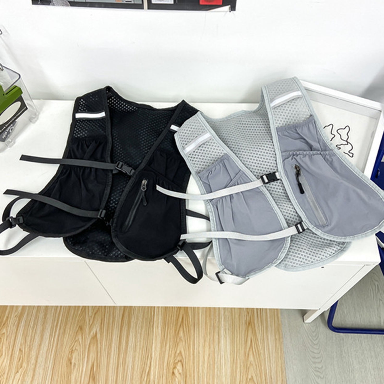 RUISINERY Adjustable Running Phone Holder Vest Reflective Water Bladder Pack Unisex Running Backpacks for Phone Card Key Towel