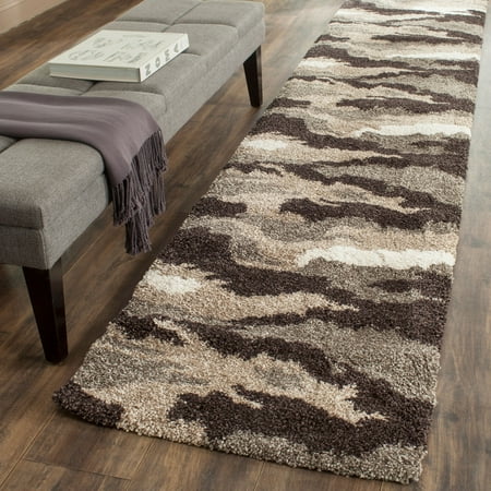 Safavieh SAFAVIEH Camouflage Shag SG453-1391 Beige / Multi Rug SAFAVIEH Camouflage Shag SG453-1391 Beige / Multi Rug Lavish natural motifs  colored in rich earth tones of ivory  beige  brown and grey  drift across soft plush pile of this camouflage Florida shag by SAFAVIEH. The distinctive high-low pile is soft underfoot while also adding alluring textures and decorative dimension to urban or metro-chic furnishings. Power-loomed using durable synthetic yarns for a long-lasting charm and beauty. Rug has an approximate thickness of 1.2 inches. For over 100 years  SAFAVIEH has set the standard for finely crafted rugs and home furnishings. From coveted fresh and trendy designs to timeless heirloom-quality pieces  expressing your unique personal style has never been easier. Begin your rug  furniture  lighting  outdoor  and home decor search and discover over 100 000 SAFAVIEH products today.