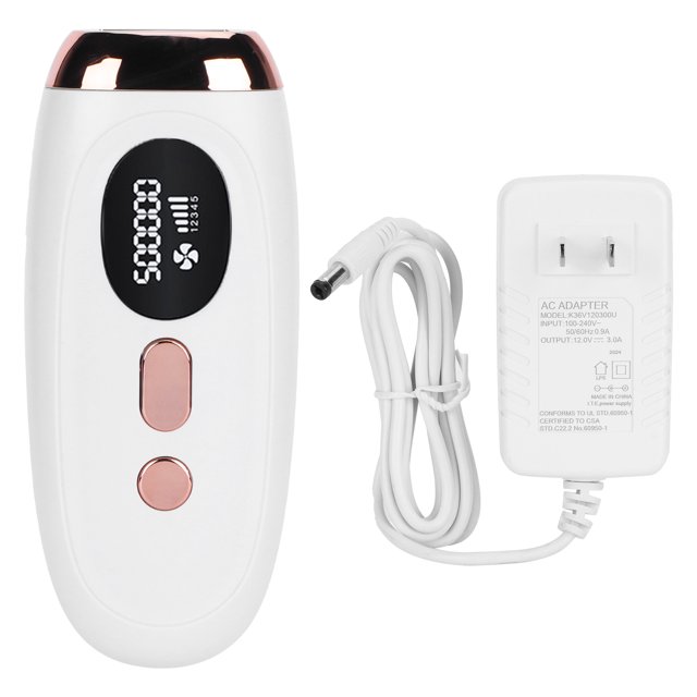 máquina de depilación láser ipl flash 500.000 Minidepiladora eléctrica permanente EE. UU. 100-240V, vista frontal centrada del depilador blanco con borde rosado metálico, pantalla LCD que muestra "500000" y dos botones rosados, cable y adaptador de pared blancos a la derecha; carcasa ABS, tamaño aprox. 16.9x7.2x4.5 cm (6.7x2.8x1.8 in), peso aprox. 630 g (22.2 oz) y longitud de onda 570–1100 nm; su tamaño compacto lo hace adecuado también para llevar en kits de viaje de cuidado personal.