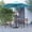 Teal, variant on Merrick Lane Five Piece Faux Teak Patio Dining Set Includes 35" Square Table, Two Club Chairs, 9' Teal Patio Umbrella and Base