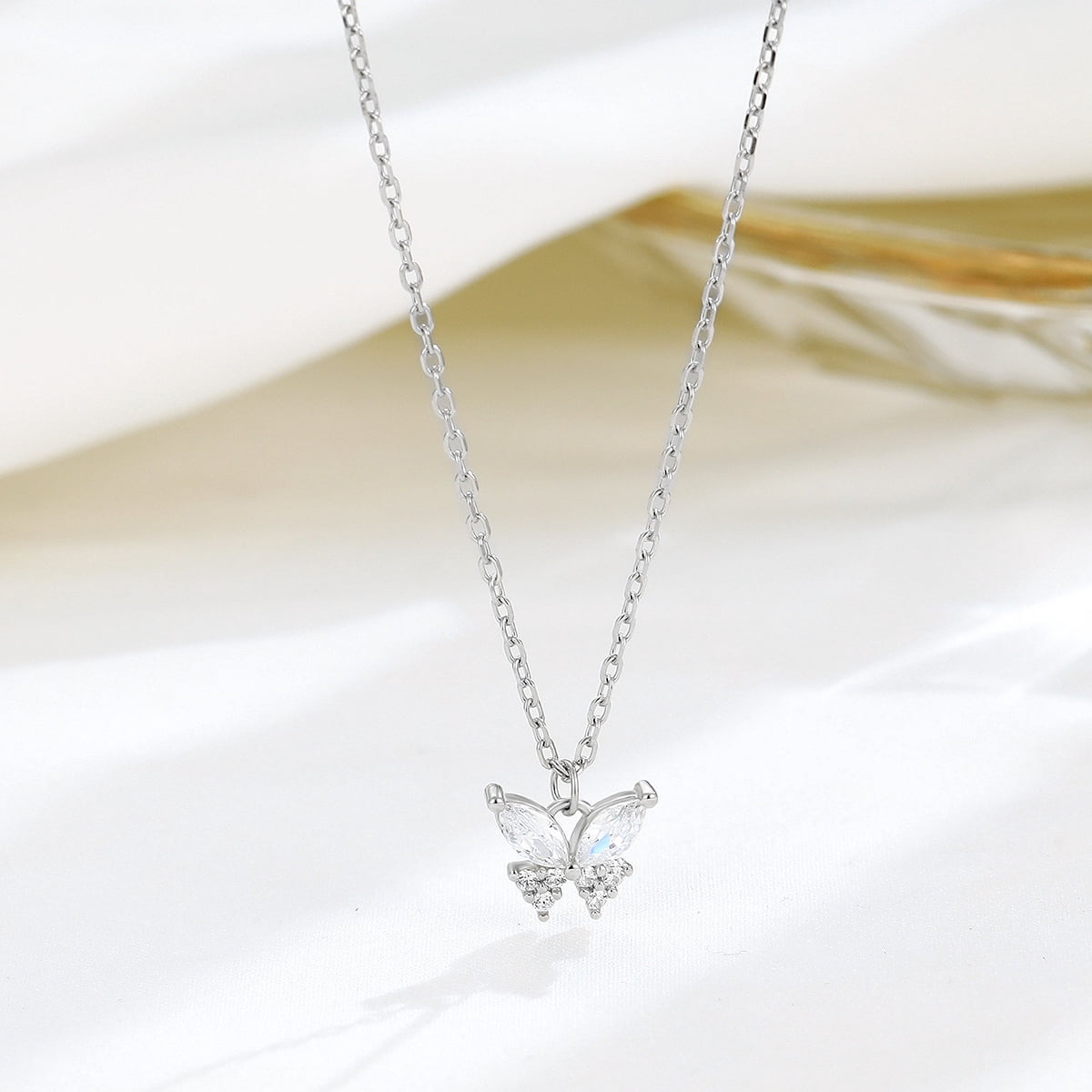 A 925 sterling silver butterfly necklace, set with dazzling diamonds, features a unique and elegant design. This simple butterfly clavicle necklace is an ideal high-end gift for women and a perfect g