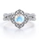 thumbnail image 1 of JeenMata Anillo Nupcial con Pavé Cruzado de Moissanita y Piedra Lunar Arcoíris de Forma Redonda de 1,75 Quilates con Diseño Floral Milgrain Estilo Art Déco en Baño de Oro Blanco de 18 K sobre Plata, 1 of 5