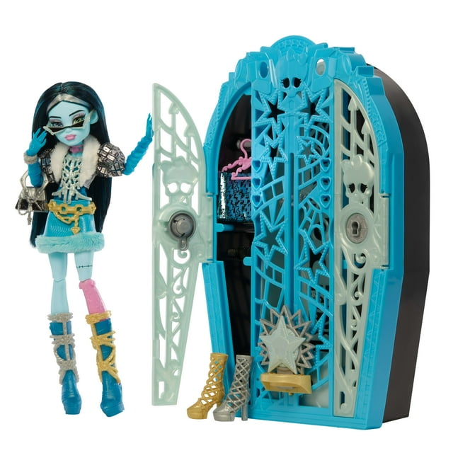 Monster High Skulltimate Secrets Hauntlywood Mysteries Doll, Frankie Stein with 19+ Surprises featuring a fully articulated doll in a blue and pink fur-trimmed outfit holding a silver purse, standing next to a blue and white star and skull-themed closet playset with three pairs of high-heeled shoes and a treasure map for interactive mystery play.