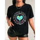 thumbnail image 1 of Camiseta informal de manga corta con cuello redondo y estampado de libro y letras para mujer, color negro. Camiseta gráfica "Enseñando la Amabilidad" con Corazón y Tierra. Algodón transpirable. Lavabl, 1 of 7