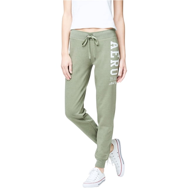 aeropostale tri-state casual jogger pantalones para mujer, verde, x-large — Joggers tobilleros verde jaspeado con corte slim, cintura elástica con cordón anudado, puños elásticos y estampado blanco vertical “AERO” en el muslo izquierdo; 60% algodón 40% poliéster, para uso casual y actividades ligeras, también se usan a menudo para viajes por su comodidad.