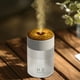 thumbnail image 4 of Humidificador de llama de colores con tecnología de nebulización, modos de niebla personalizables, gran depósito de agua de 250 ml para humedad ajustable, iluminación ambiental para relajarse, 4 of 9