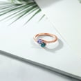 thumbnail image 3 of Gem Stone King 18K Rose Gold Plated Silver Blue Tanzanite and London Blue Topaz Bypass Ring for Women (0.87 Cttw, Gemstone December Birthstone, Round 4MM, Size 9), 3 of 4