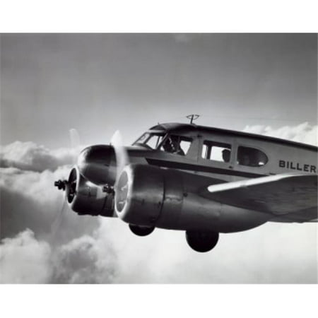 Low angle view of an aircraft in flight Twin Engine Cessna Poster