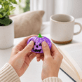 thumbnail image 3 of Halloween Pumpkin Squishy Toy, Purple Glitter Jack O Lantern Stress Ball with Green Stem, Slow Rising Fidget Toy, Sensory Squeeze Ball for Adults, Halloween Party Favor Gift, 3 of 3