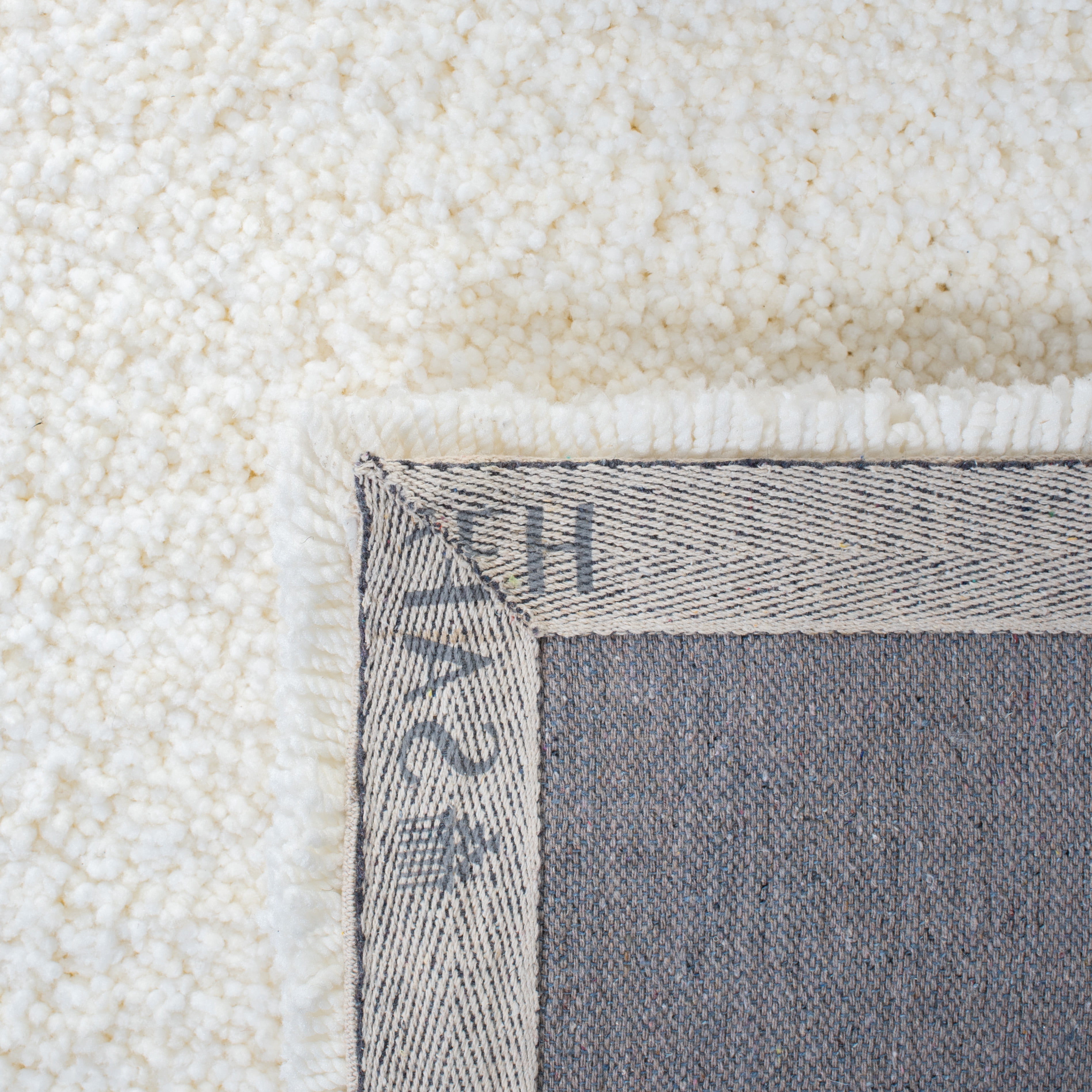 Safavieh Ultimate Atanas Solid Polyester Shag Area Rug, Ivory, 6' x 9'