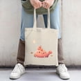 thumbnail image 2 of Cute Pink Creature Tote Bag - Adorable illustration with smiling creature orange flowers and yellow moon Perfect for shopping and travel, 2 of 4