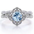 thumbnail image 1 of JeenMata Anillo Nupcial con Diseño de Milgrain Floral en Forma Redonda de 1,75 Quilates con Aguamarina Azul Cielo y Moissanita Engastado en Baño de Oro Blanco de 18 K sobre Plata, 1 of 6