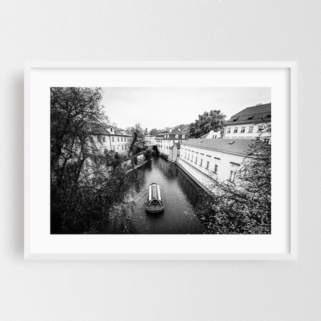 Along Certovka B&W - Prague Czechia Photography Black and White Boat Cityscape Architecture Scenic Travel Poster Bridge White Framed Wall Art Print 5 x 7 inches